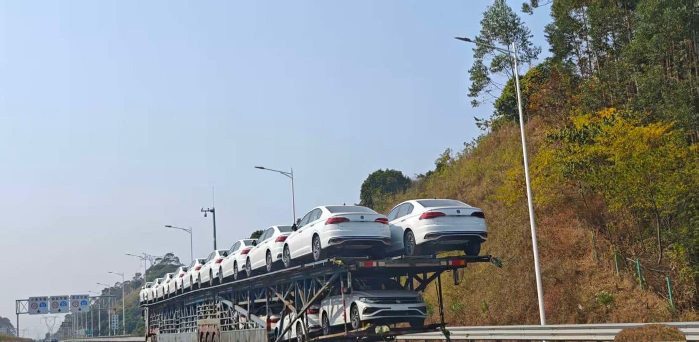 Car carrier transporting new cars on a highway